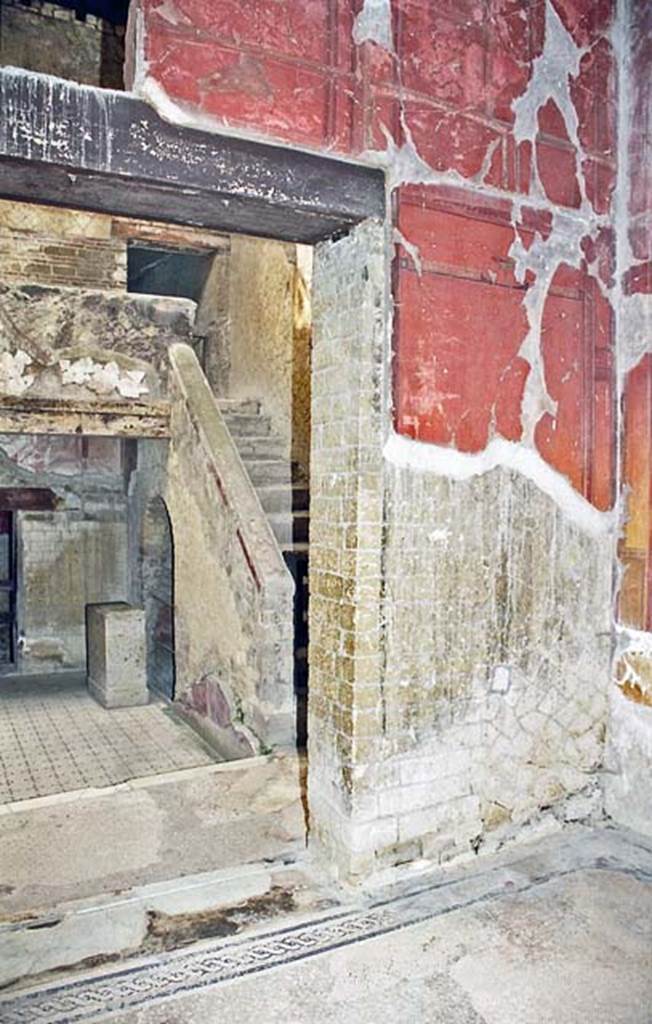 V.8 Herculaneum. October 2001. Room 7, looking north through east side of doorway into the courtyard, with steps to upper landing. Photo courtesy of Peter Woods.